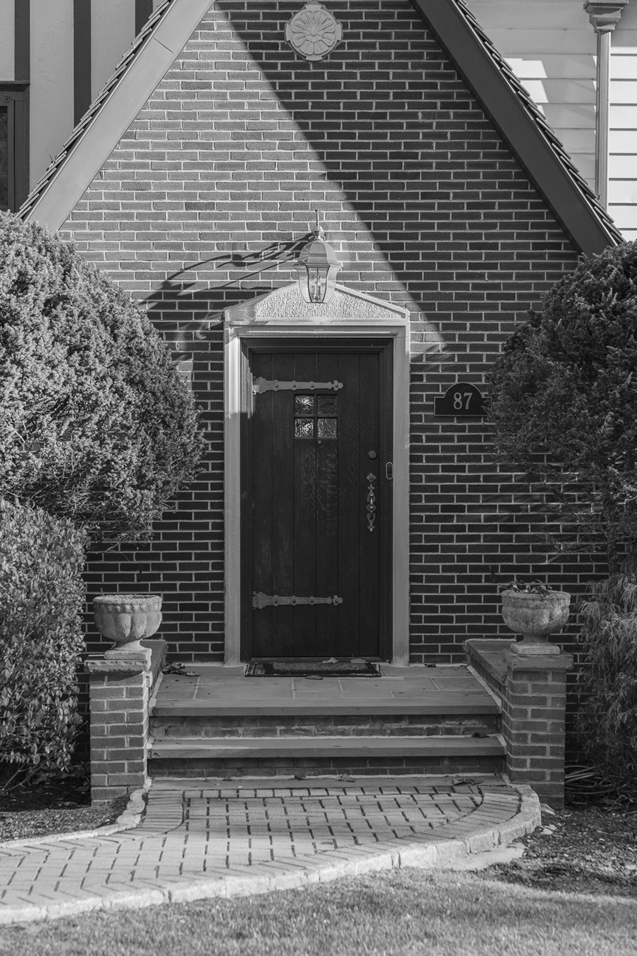 The doorway to a house the street number which is 87